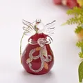 Macro view of a handcrafted red and clear glass angel figurine with a gold string - ts114 Red / Red