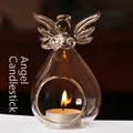 Elegant clear glass angel candle holder with warm tea light flame for decor - 11x7cm Big Belly Style
