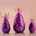 Close-up of three purple frosted translucent glass angel figurines with elegant pearl accents - Purple Pearl Embellished Style (ts069)
