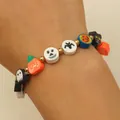 Handmade Halloween beaded bracelet featuring pumpkin ghost and bat charms on wrist - Bat Ghost Polymer Clay Beaded Style (3716) / Colorful