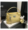Yellow quilted bucket bag with chain strap and cute bear pendant for daily chic commuting. - With Charm / Yellow
