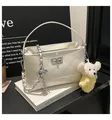 White quilted shoulder bag with chain strap, top handle and cute bear pendant for women. - With Charm / White