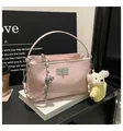 Pink quilted bucket shoulder bag with chain strap and cute bear charm for women daily commute. - With Charm / Pink