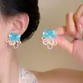 Detail view of sweet dopamine style begonia flower beaded earrings in blue and pink - Blue (E6960)