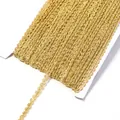 Detailed close-up view of metallic gold S-shaped wave lace ribbon trim wound on white card. - 0.5cm Wide 25 Yards/Pack / Middle Gold