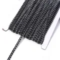 Close-up detail view of black and silver metallic wave trim ribbon, ideal for sewing. - 0.5cm Wide 25 Yards/Pack / Black Silver