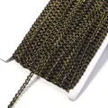 Black and gold metallic wavy braid trim close up, detailed view of S-shaped ribbon edging. - 0.5cm Wide 25 Yards/Pack / Black & Gold