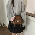 Chic vintage brown faux leather backpack with silver bow and plush doll charm for women - Brown (With Charm)