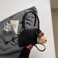 Black PU leather bowling handbag with bear charm, stylish top handle crossbody pillow bag. - With Pendant / Black