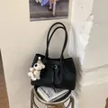 Elegant black woven tote bag for women with a cute white bear charm accessory. - With Pendant / Black