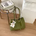 Elegant olive green woven leather tote bag with white plush bear charm and buckle - With Pendant / Green