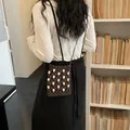 Handmade vertical brown crocheted phone bag featuring beige beads and a thin shoulder strap - Coffee