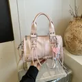 Pink PU leather Boston handbag for women, stylish crossbody bag with cute heart charm and tassels. - With Pendant / Pink