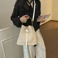 Stylish straw bucket bag with bamboo handle and white shoulder strap for women beach summer daily. - Off White