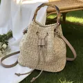 Straw bucket bag for women, summer beach woven handbag with bamboo handle and crossbody strap. - Light Khaki