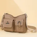 Stylish soft leather large capacity shoulder crossbody bag with front pockets and wide strap. - Khaki