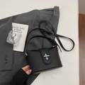 Small black pebbled leather bucket bag for women with elegant silver metal buckle - No Pendant / Black