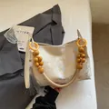 New Chinese style retro printed handbag with wooden beaded handle and elegant tassel. - Yellow