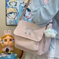 Sac bandoulière rose en toile avec broderie florale et charm peluche pour un usage quotidien. - Avec Pendentif / Rose
