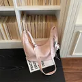 Detailed view of the trendy pink PU leather hobo shoulder bag with cute charm design. - With Pendant / Pink With Pendant