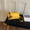 Chic yellow barrel pillow bag with cute strawberry charms and an adjustable strap - With Pendant / Yellow
