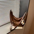 Stylish brown PU leather shoulder dumpling bag for women, trendy crossbody hobo bag with cute charm. - With Pendant / Brown With Charm