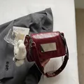 Red PU leather shoulder bag for women with chain strap and cute plush charm daily use. - Red With Pendant