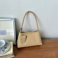 Elegant beige woven underarm shoulder bag with braided handle for women's fashion - Yellow