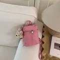 Pink bucket crossbody phone bag with soft suede texture and a cute furry dog charm - Rose Red With Charms