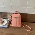Elegant pink minimalist crossbody bucket phone bag featuring a cute white bear plush charm - Pink With Pendant