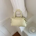 Elegant cream yellow Boston handbag featuring a chic pillow shape and crossbody strap - Basic Style / Yellow