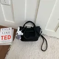 Premium black lychee textured leather commuter bucket bag with a cute plush dog charm for women - Black With Pendant