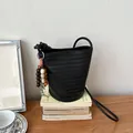 Black woven bucket bag for women, stylish leather crossbody shoulder bag with chic bead charm. - With Charm / Black