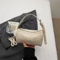 Beige woven cylinder handbag, elegant tubular shoulder bag with adjustable strap. - Off White