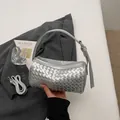 Silver woven cylinder shoulder bag for women, stylish faux leather handbag with adjustable strap. - Silver