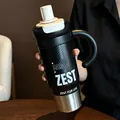 Detailed view of large capacity black insulated tumbler with handle and stylish text print. - Black