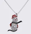 Close-up detail of the sparkling Christmas snowman rhinestone pendant necklace sparkle accessory. - Bright White K