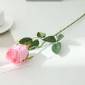 Close-up detail view of single pink artificial silk rose with realistic green stem and leaves. - Light Pink