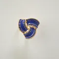 Elegant gold-tone three-ring scarf buckle adorned with blue rhinestones and glossy enamel. - Silver Edge - Blue