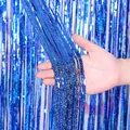 Close-up view of shimmering blue tinsel curtain strands showing shiny texture and good drape. - Laser Blue