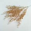Gold artificial plant branch detail, wedding decorative floral arrangement, shimmering gold eucalyptus leaves. - Large Milan Grass