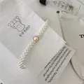 Women's Elegant Multi-Strand Pearl Waist Chain Elastic Rhinestone Dress Belt Chic - Golden Semicircle Buckle