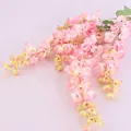 Detailansicht rosa künstlicher Wisterienblüten für Hochzeits- und Heim-Wandbehang-Dekoration. - Dunkelrosa