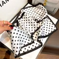 Black and white polka dot silk square scarf with elegant black border, chic fashion accessory. - 19120-Main Image