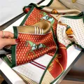 Luxury silk scarf with equestrian horse print, elegant red and green long neckerchief for women. - 19123-Main Image