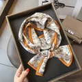 Elegant silk twilly scarf with floral sketch print and orange border for stylish women. - 19212-Main Image