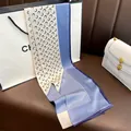 Elegant long silk scarf featuring modern crescent moon pattern and classic color block style. - Blue