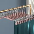 Perchas para pantalones de acero inoxidable con pinzas, revestidas, variante marrón miel. - Marrón Té de Miel