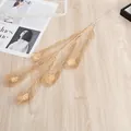 Gold artificial peacock feather decorative leaf branch for home and Spring Festival decor. - Peacock Feather / Gold