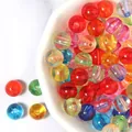 Close-up of colorful transparent acrylic round beads, ideal for DIY jewelry accessories. - 100 Pieces/Pack (Size: 6mm) / Mixed Transparent Colors